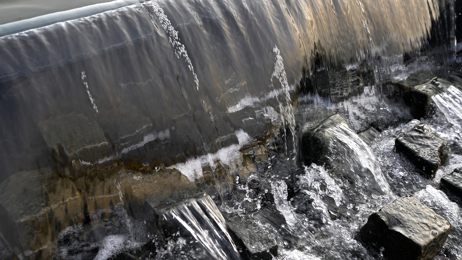 Water feature in a contemporary garden with reflecting pool and fountains