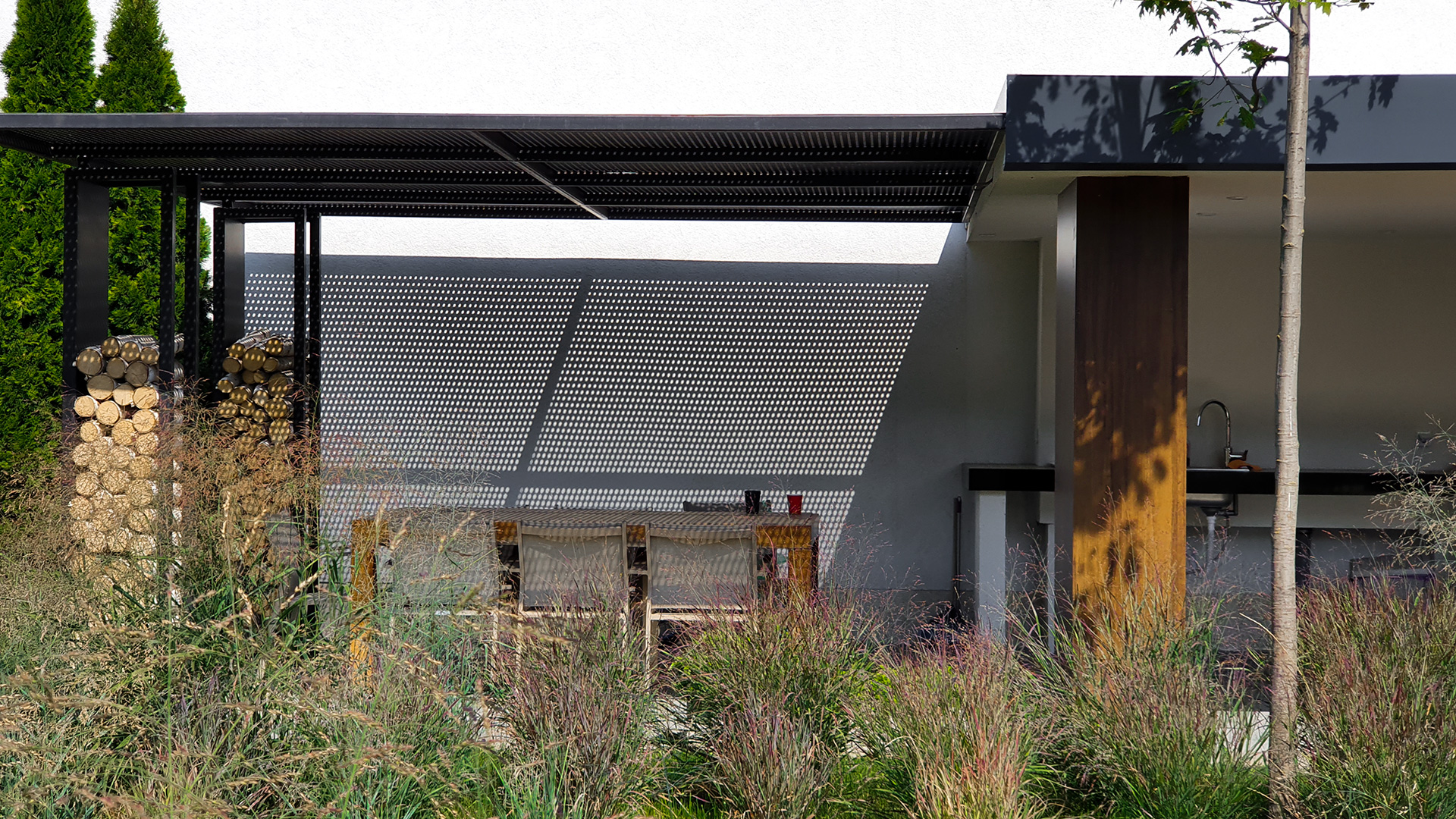 Contemporary garden design in Bucharest with natural stone and modern planting schemes