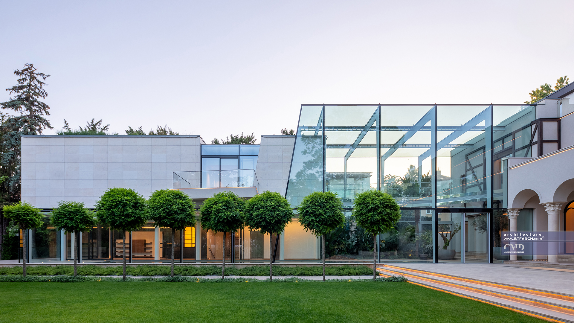 Lush green garden design with aligned trees and soft lawn in a classic landscape setting
