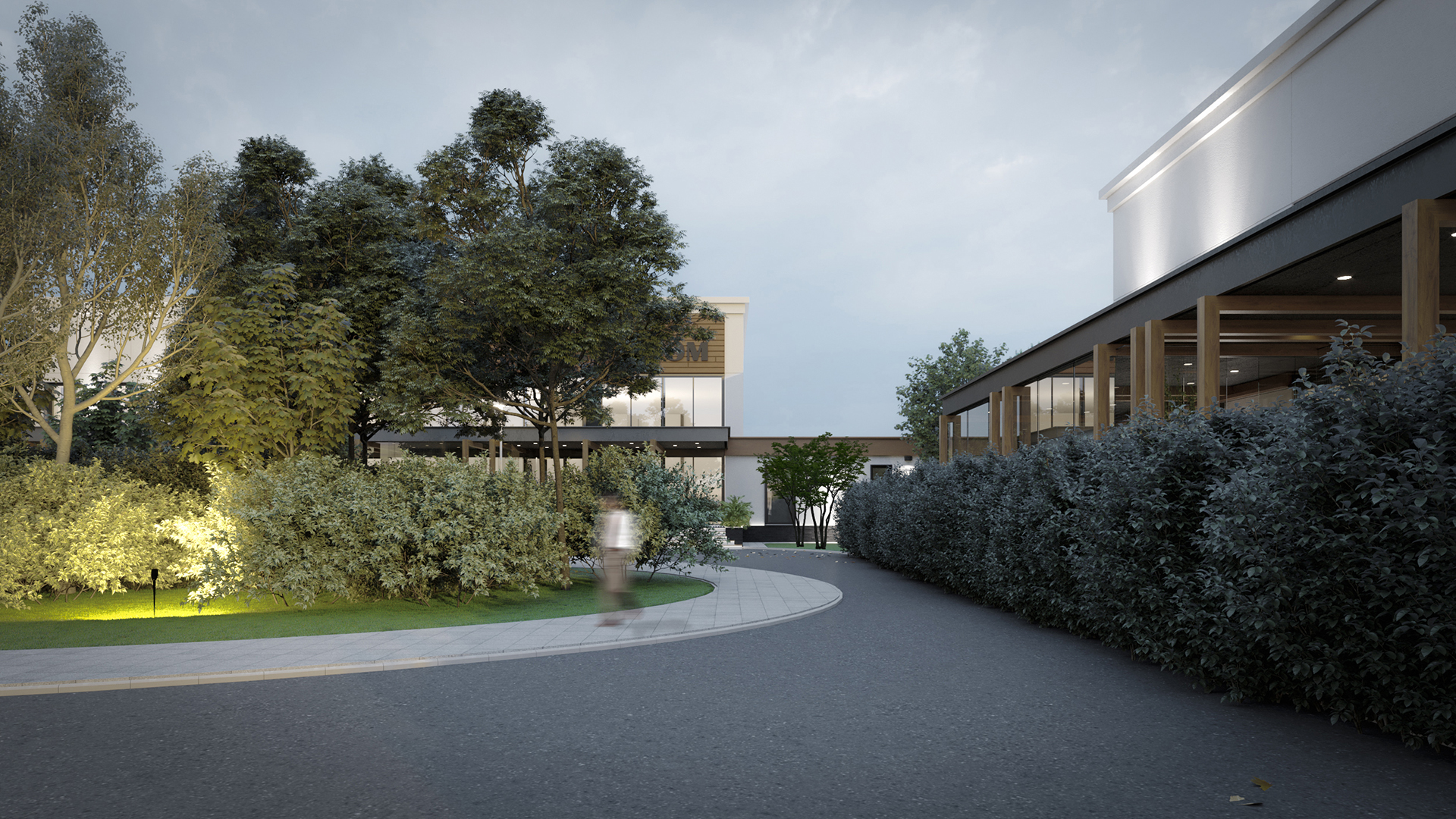 Side garden next to event hall with hedges and pathway lighting