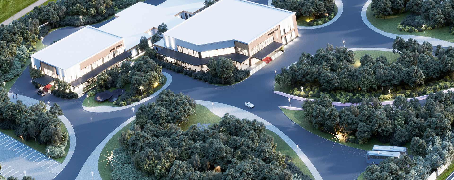 Wide aerial view of the three event halls surrounded by landscaped greenery