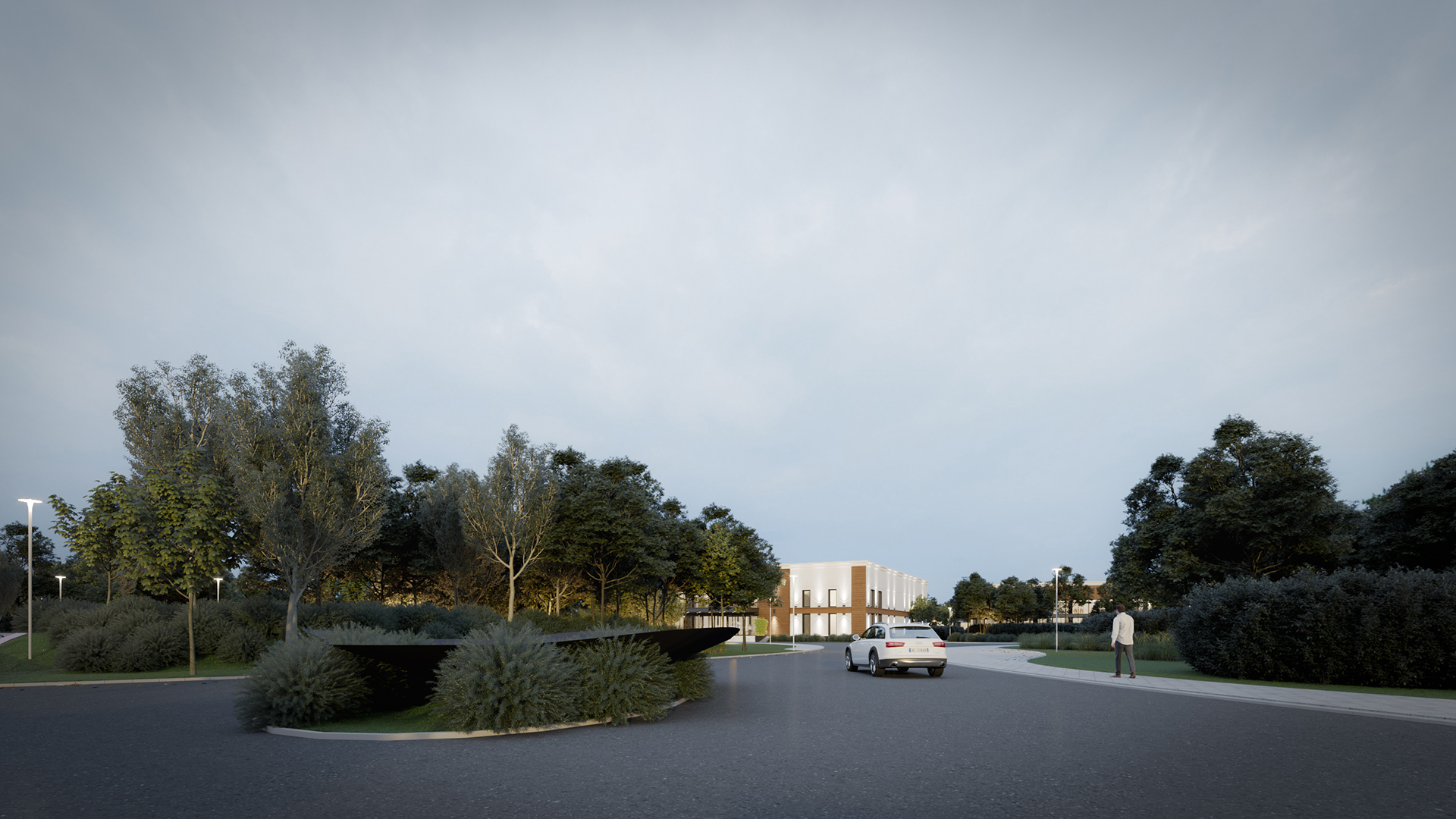 Driveway and green landscaping leading to event hall complex